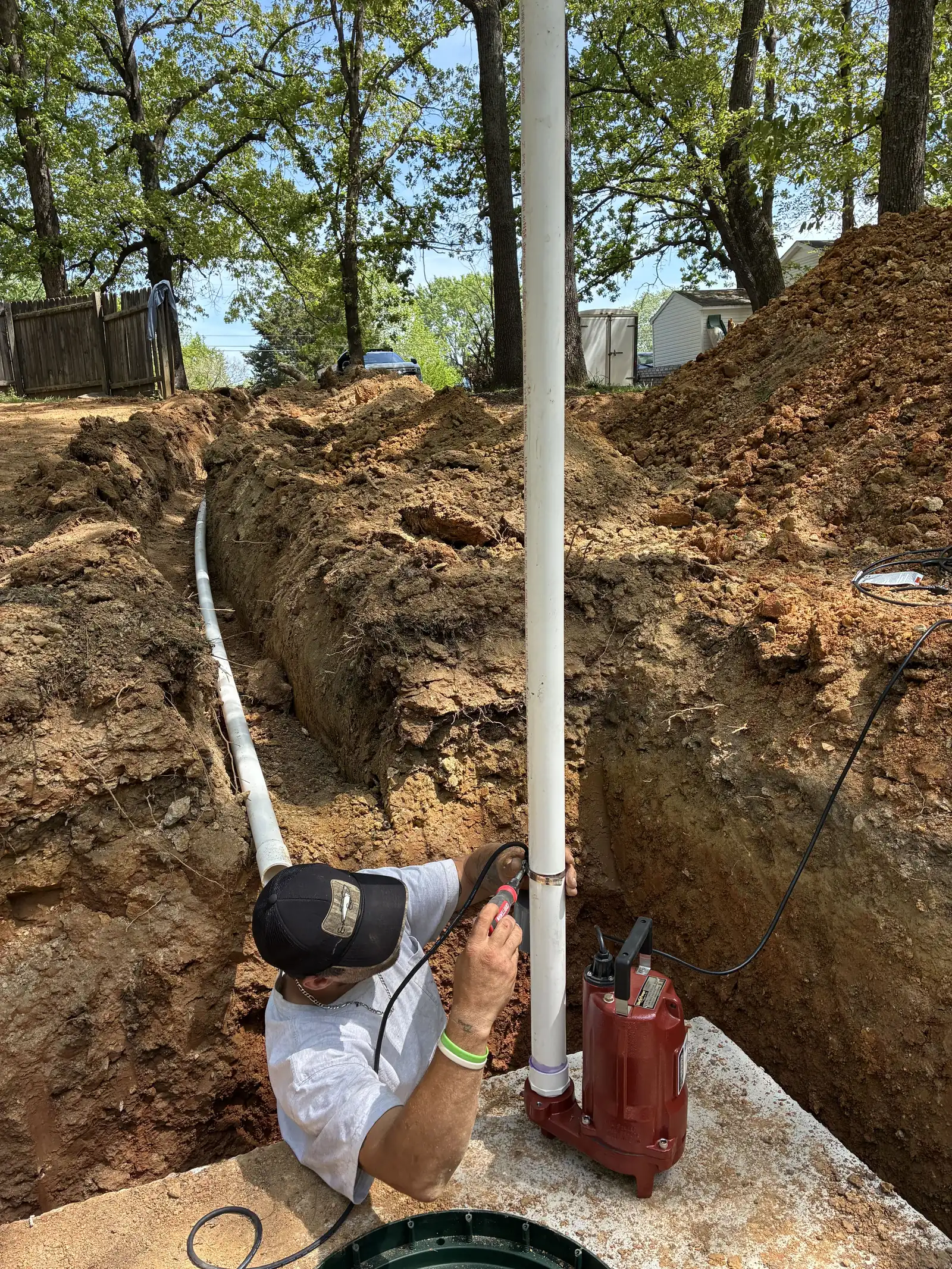 Septic services in Millersville, TN: a sewage pump set in the tank with the new line running up the trench